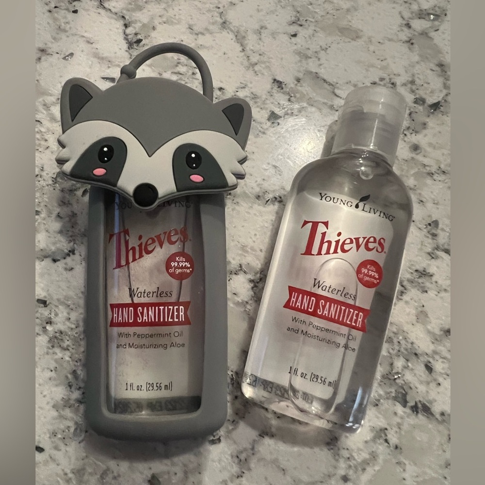 Young Living Thieves Waterless Hand Sanitizer With Gray Raccoon Holder